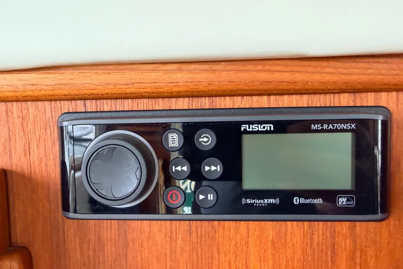 Slide: The Image of Fusion MS-RA70NSX stereo system on 2002 American Tug 34 boat, featuring Bluetooth and SiriusXM. - 20