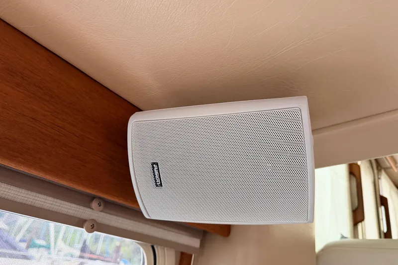 Slide: The Image of White Fusion speaker mounted on American Tug 34, 2002 model, interior wooden panel. - 26
