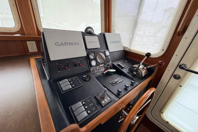Slide: The Image of American Tug 34 helm with Garmin navigation equipment, 2002 model. - 36