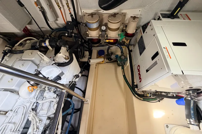 Slide: The Image of Engine room of a 2002 American Tug 34 with visible machinery and components. - 51