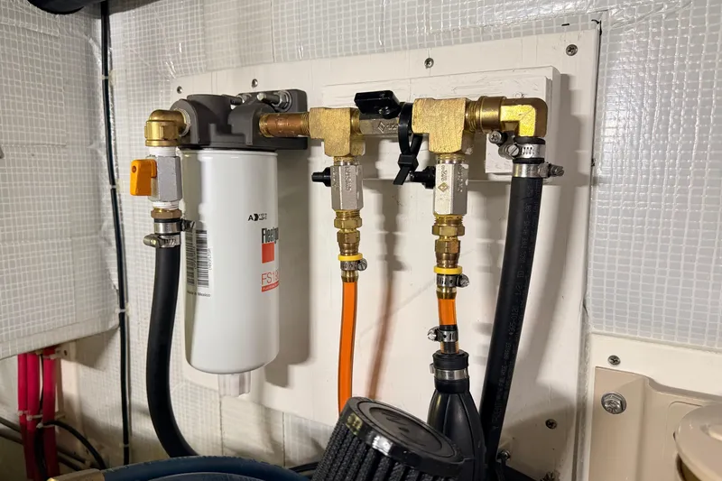 Slide: The Image of Engine room fuel filter system in a 2002 American Tug 34 boat. - 54