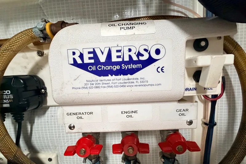 Slide: The Image of Reverso oil change system in a 2002 American Tug 34 boat engine room. - 56