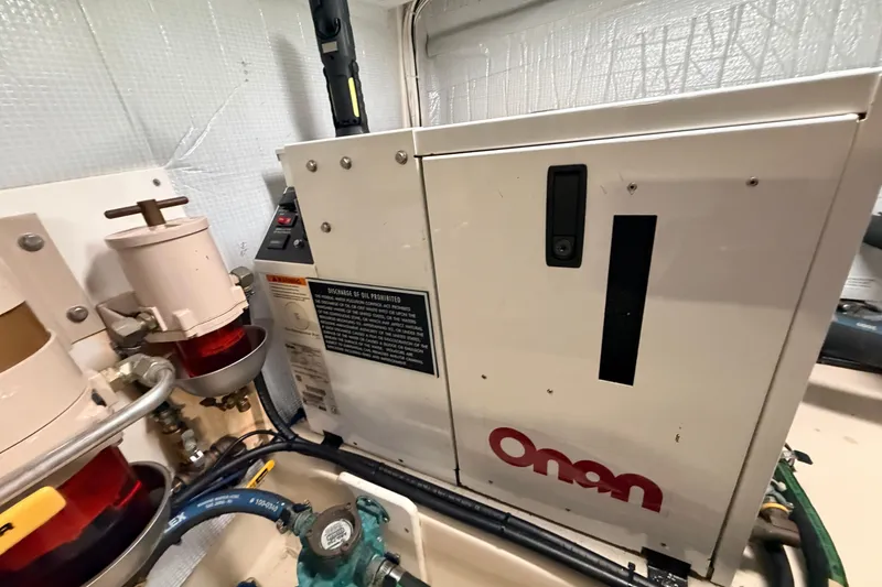 Slide: The Image of Engine room of 2002 American Tug 34 with Onan generator. - 58