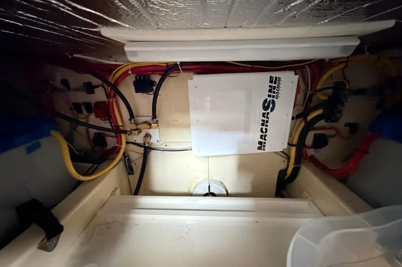 Slide: The Image of Electrical wiring and components inside a 2002 American Tug 34 boat. - 62