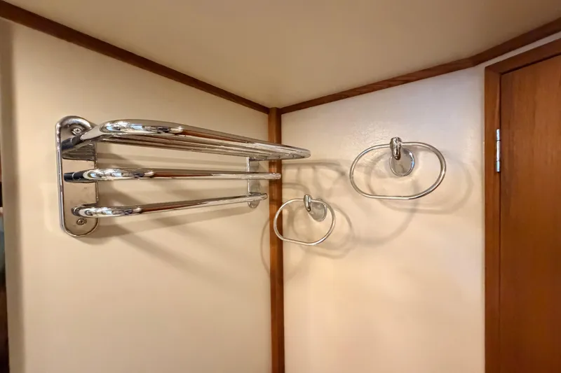 Slide: The Image of Chrome towel rack and hooks in a 2002 American Tug 34 boat interior. - 81