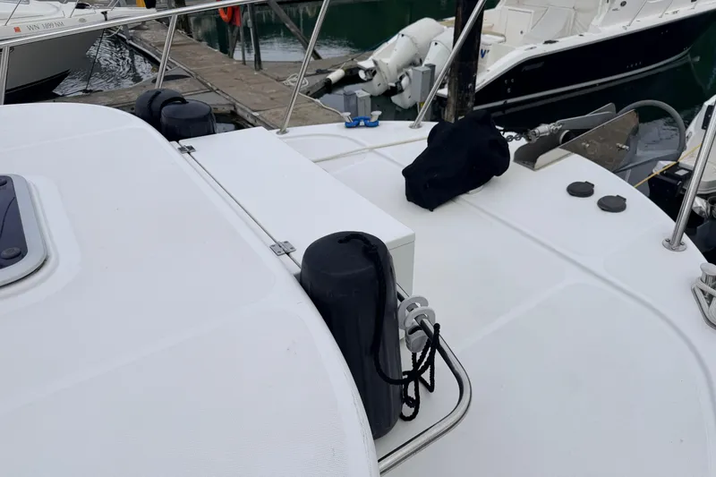 Slide: The Image of American Tug 34 (2002) boat deck with fenders and dock view. - 87