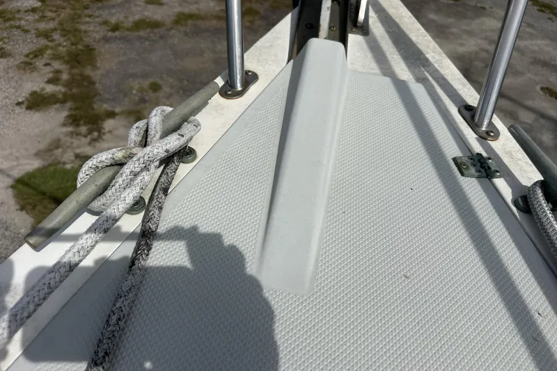 Slide: The Image of Deck of 1991 Catalina 42 sailboat with ropes and metal fittings. - 104