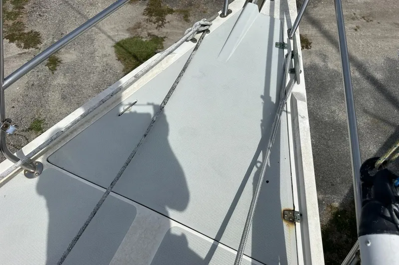 Slide: The Image of Deck of a 1991 Catalina 42 sailboat with railing and ropes. - 109