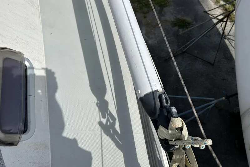 Slide: The Image of Deck view of a 1991 Catalina 42 sailboat, showing rigging and shadow. - 110