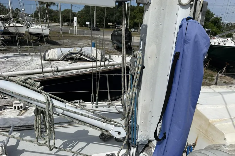 Slide: The Image of Deck view of a 1991 Catalina 42 sailboat with rigging and blue sail cover. - 114