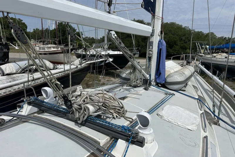 Slide: The Image of Sailboat deck of a 1991 Catalina 42 with rigging and ropes. - 117