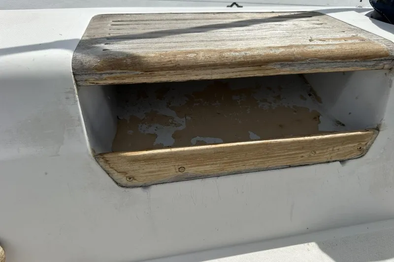 Slide: The Image of Weathered wooden hatch on a 1991 Catalina 42 sailboat deck. - 120