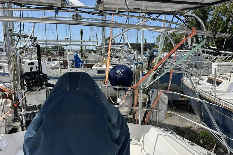 Slide: The Image of Cockpit view of a 1991 Catalina 42 sailboat in a marina. - 123