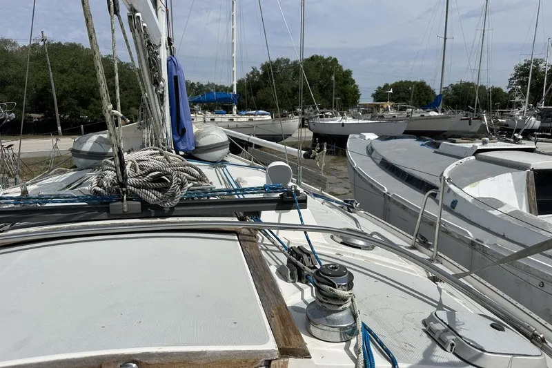 Slide: The Image of Sailboat deck view of a 1991 Catalina 42, docked among other boats. - 126