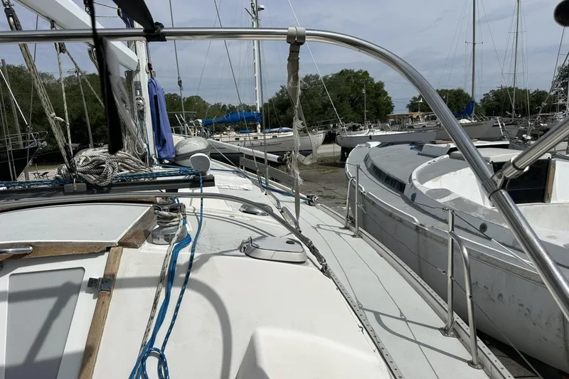 Slide: The Image of Sailboat deck view of 1991 Catalina 42, docked among other boats. - 127