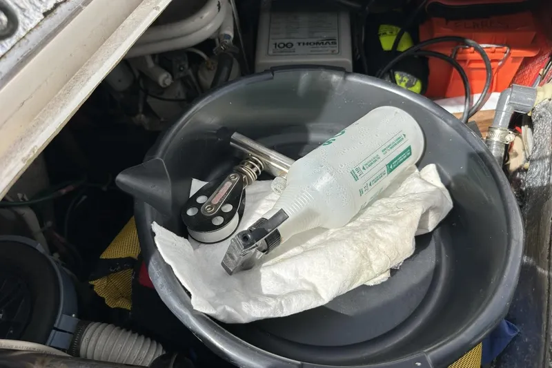 Slide: The Image of Engine compartment of a 1991 Catalina 42 with tools and cleaning supplies. - 138
