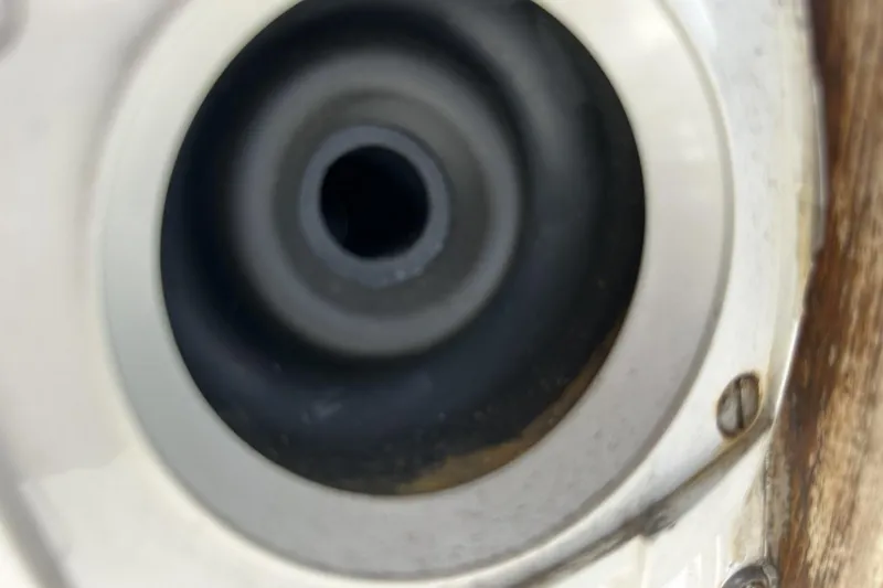 Slide: The Image of Close-up of a 1991 Catalina 42 sailboat's deck fitting with metal screws. - 145