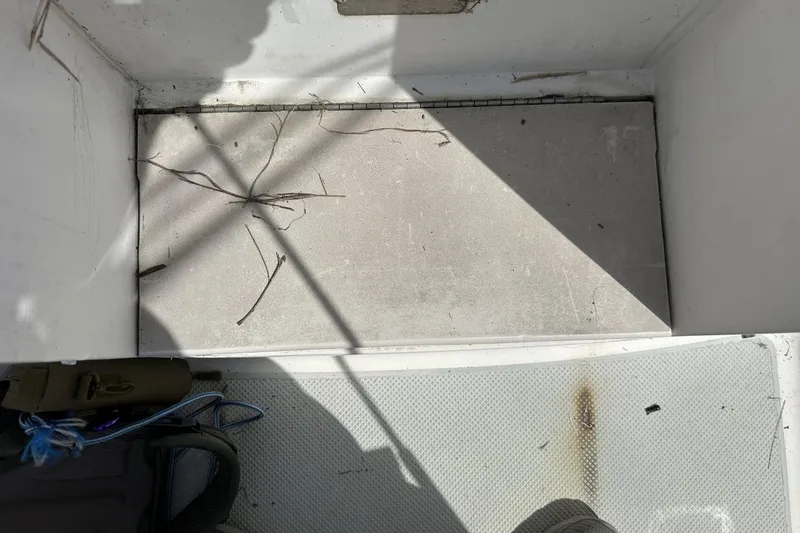 Slide: The Image of Boat storage compartment with debris, Catalina 42, 1991 model. - 148