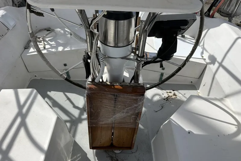 Slide: The Image of Cockpit of a 1991 Catalina 42 sailboat with steering wheel and controls. - 150