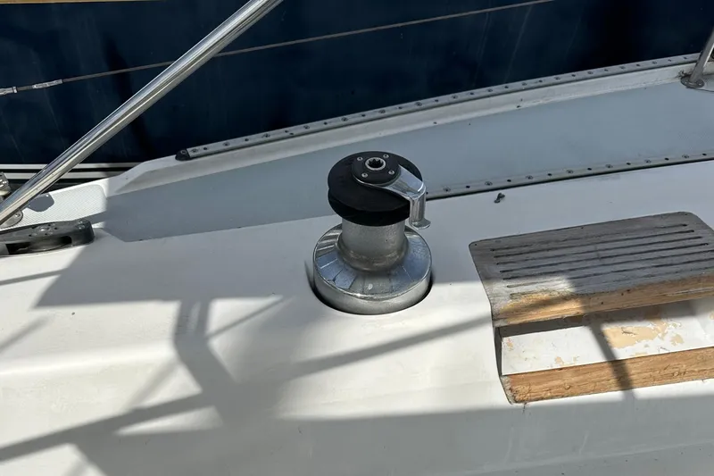Slide: The Image of Sailboat deck with winch and wooden step, Catalina 42, 1991 model. - 153