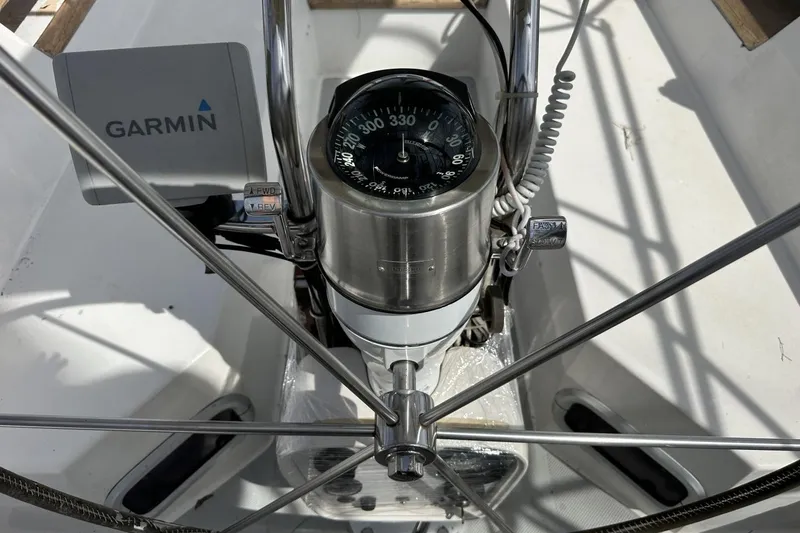 Slide: The Image of Steering wheel and compass on a 1991 Catalina 42 sailboat with Garmin navigation. - 159
