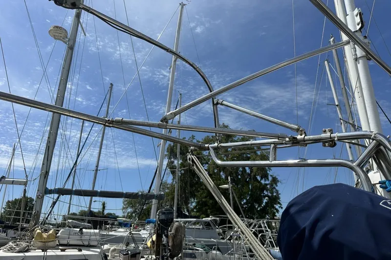 Slide: The Image of Sailboat rigging on a 1991 Catalina 42 under a clear blue sky. - 16