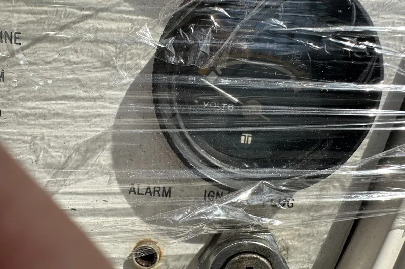 Slide: The Image of Voltmeter on 1991 Catalina 42 yacht dashboard, wrapped in protective plastic. - 166