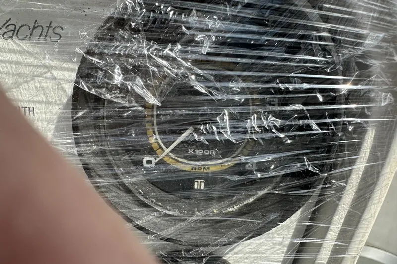 Slide: The Image of RPM gauge of a 1991 Catalina 42 yacht, wrapped in protective plastic. - 167