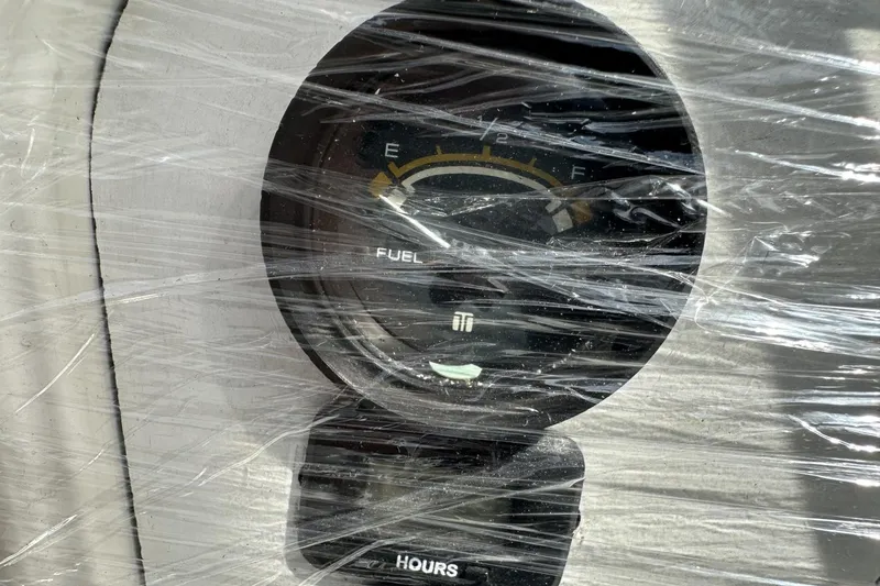 Slide: The Image of Fuel gauge and hour meter on 1991 Catalina 42, wrapped in protective plastic. - 171