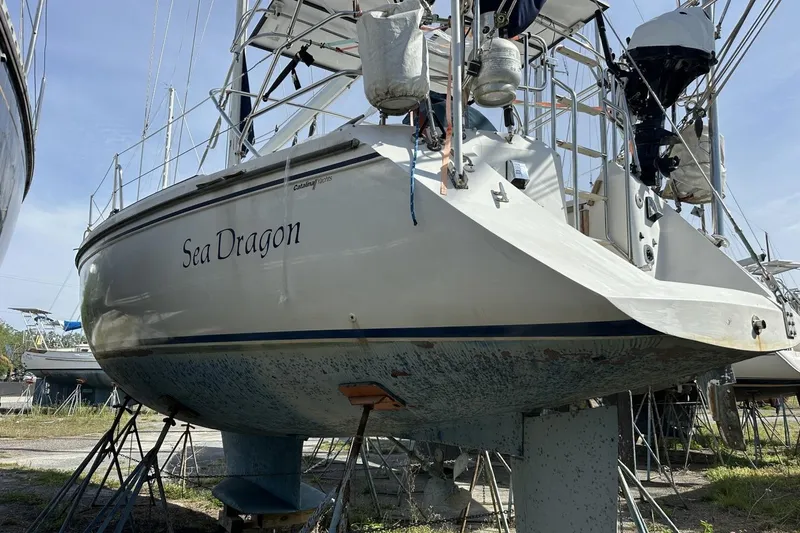 Slide: The Image of Catalina 42 sailboat "Sea Dragon" on stands, 1991 model, in a boatyard. - 183
