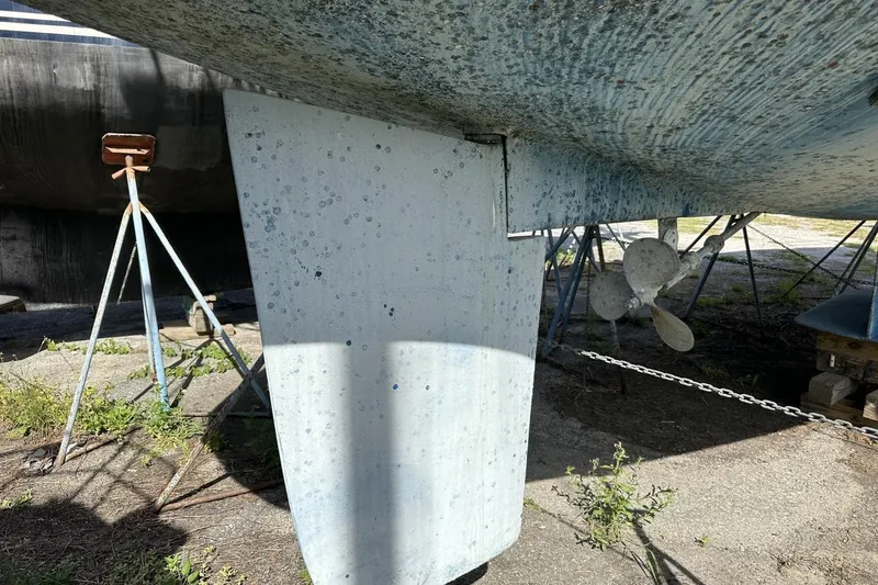 Slide: The Image of Close-up of a 1991 Catalina 42 sailboat keel and propeller on dry dock. - 187
