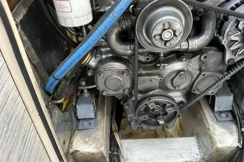 Slide: The Image of Engine compartment of a 1991 Catalina 42 sailboat, showing belts and hoses. - 19