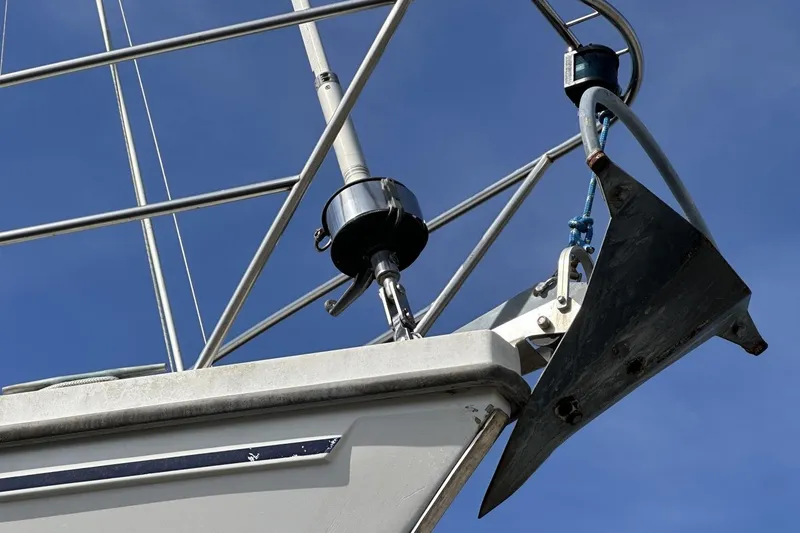 Slide: The Image of Bow of 1991 Catalina 42 sailboat with anchor and rigging against blue sky. - 193