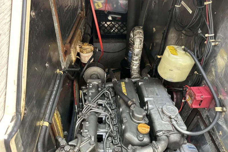 Slide: The Image of Engine compartment of a 1991 Catalina 42 sailboat, featuring a Yanmar engine. - 21