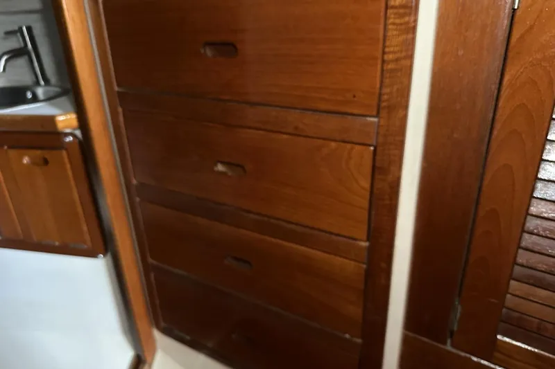 Slide: The Image of Wooden cabinetry and sink inside a 1991 Catalina 42 sailboat interior. - 37