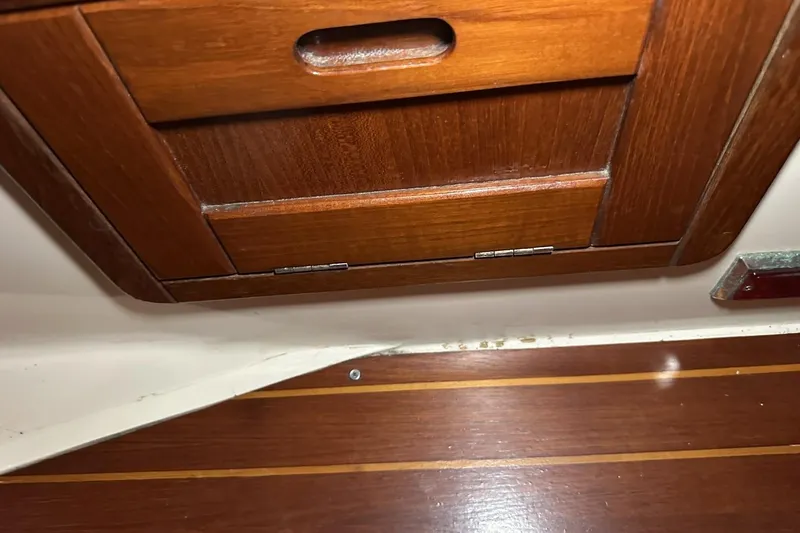 Slide: The Image of Wooden cabinet and floor inside a 1991 Catalina 42 sailboat. - 39