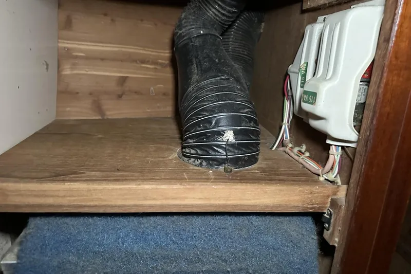 Slide: The Image of Interior of a 1991 Catalina 42 showing wiring and ventilation hose. - 42