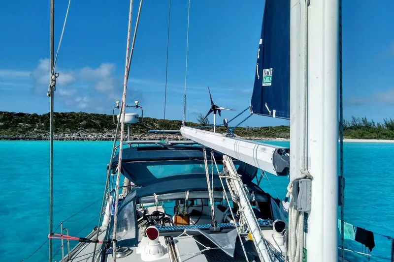 Slide: The Image of Sailing on a 1991 Catalina 42 yacht in clear turquoise waters. - 5