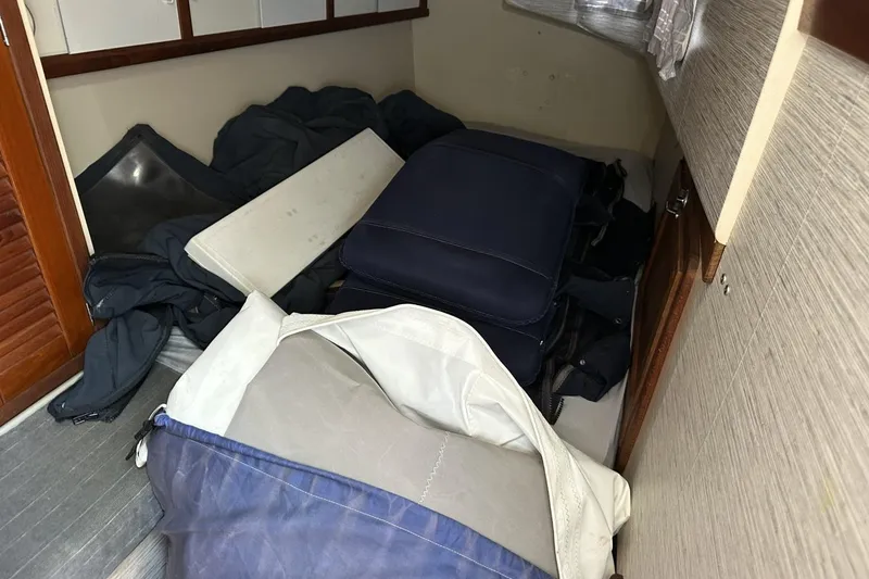 Slide: The Image of Interior of a 1991 Catalina 42 sailboat with cushions and gear stored. - 65