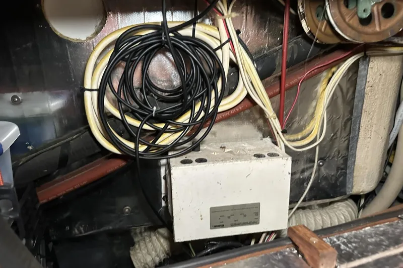 Slide: The Image of Electrical wiring and components inside a 1991 Catalina 42 sailboat. - 69