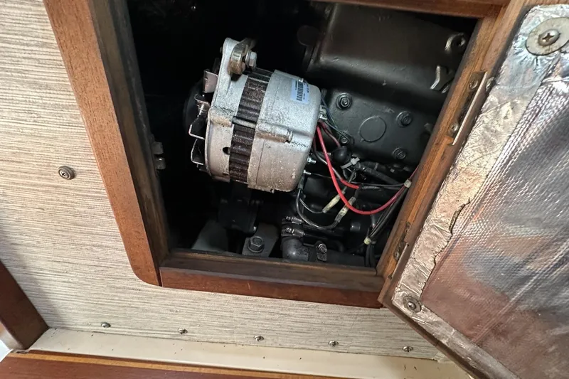 Slide: The Image of Engine compartment of a 1991 Catalina 42 sailboat, showing alternator and wiring. - 71