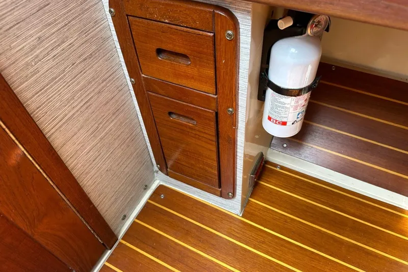 Slide: The Image of Wooden cabinetry and fire extinguisher on 1991 Catalina 42 yacht interior. - 75