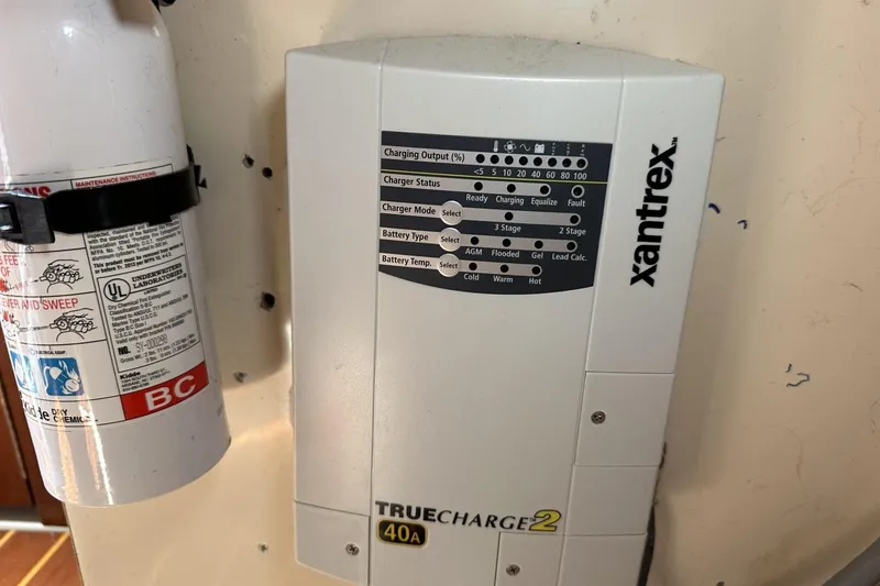 Slide: The Image of Xantrex TrueCharge2 40A charger and fire extinguisher on Catalina 42, 1991 model. - 76