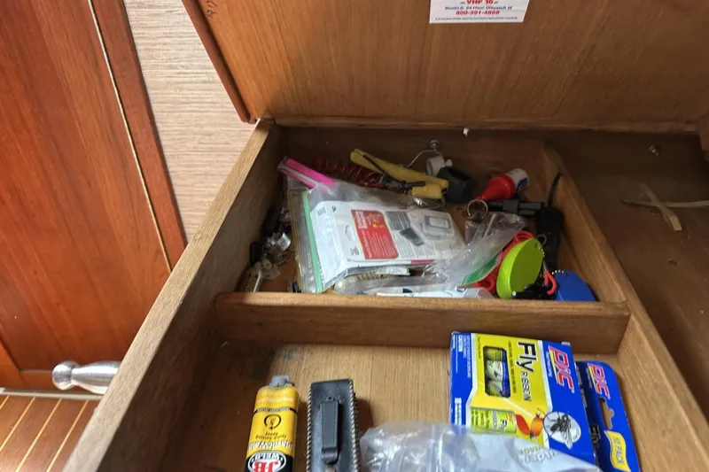 Slide: The Image of Drawer with assorted tools and items on a 1991 Catalina 42 sailboat. - 78