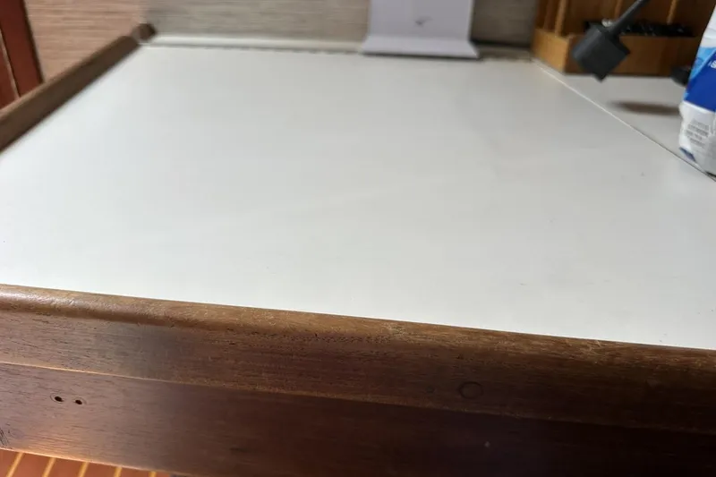 Slide: The Image of Wooden and white countertop on a 1991 Catalina 42 sailboat interior. - 79