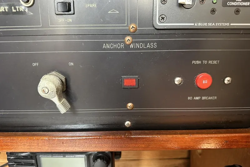 Slide: The Image of Control panel of a 1991 Catalina 42 sailboat with anchor windlass switch. - 85