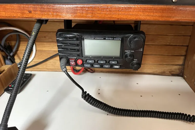 Slide: The Image of Marine radio equipment on a 1991 Catalina 42 sailboat, featuring Standard Horizon Matrix AIS/GPS. - 86