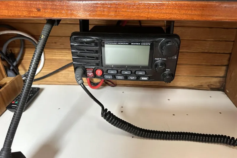 Slide: The Image of Marine radio equipment on a 1991 Catalina 42 sailboat, featuring Standard Horizon Matrix AIS/GPS. - 87