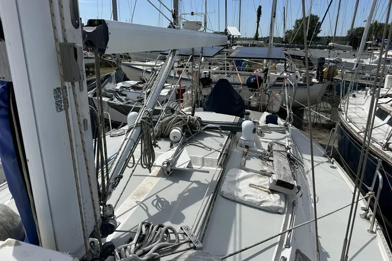 Slide: The Image of Sailboat deck view of a 1991 Catalina 42 in a marina. - 99