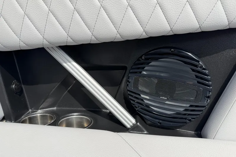 Slide: The Image of 2024 Tigé Z1 interior with speaker, cup holders, and quilted upholstery. - 16
